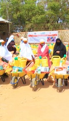 Women receiving the farming tools and seeds in Baidoa.jpg